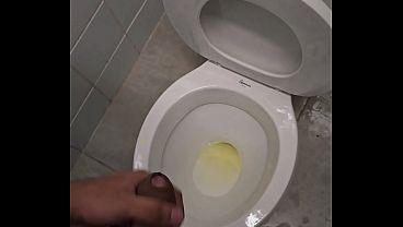 Urinating in a public restroom