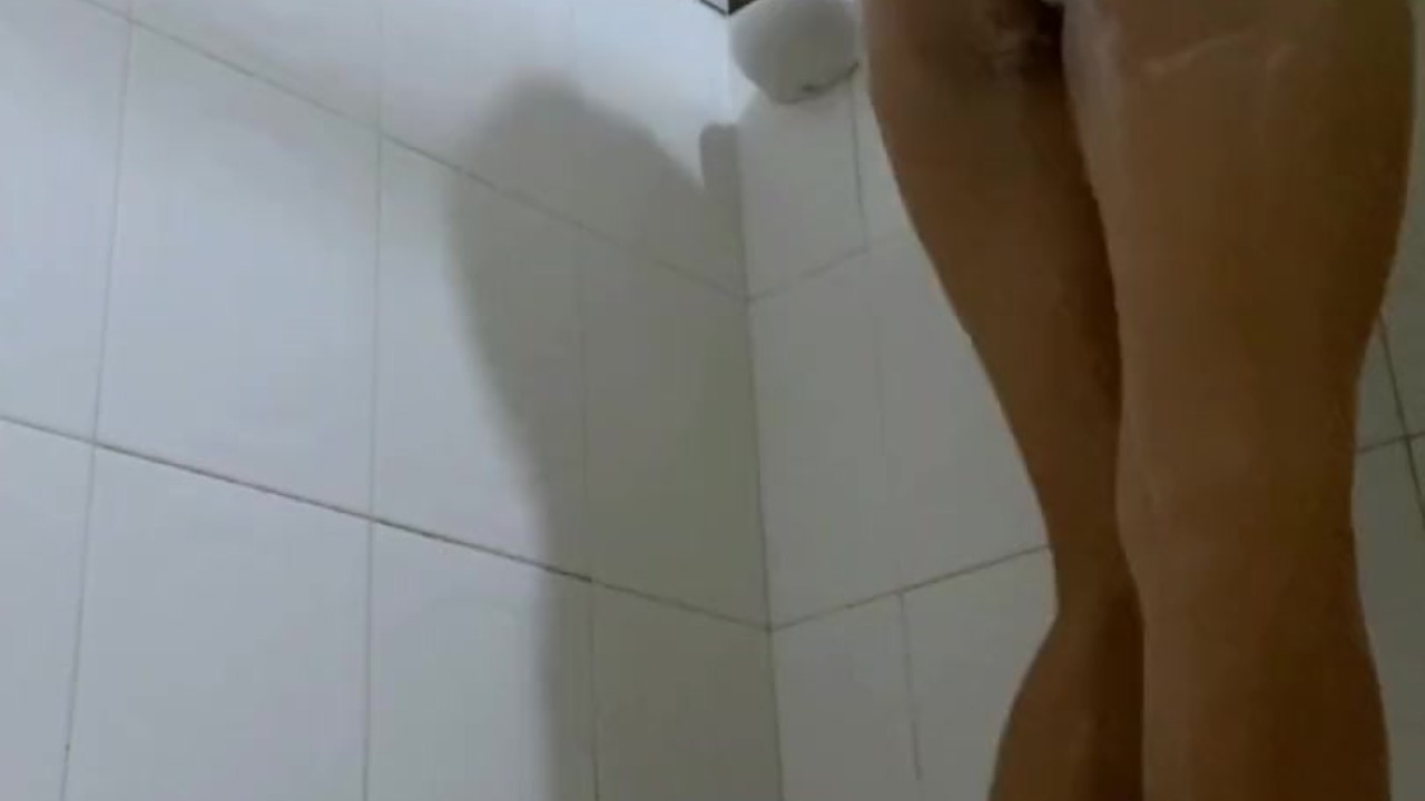 busty Latina takes a hot shower and rubs her pussy - Nani