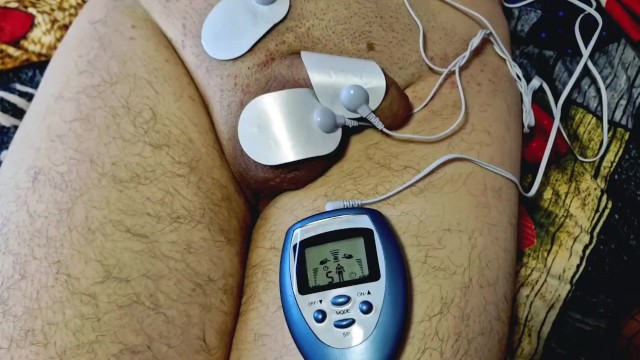 Dominatrix Nika plays with electric discharges on the genitals of the slave. Electrostimulation