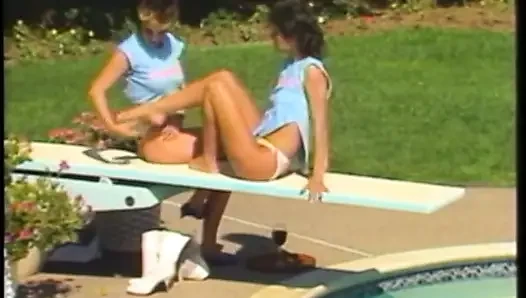 Sexy brunette babe rides her friend's huge strap-on with her tight twat