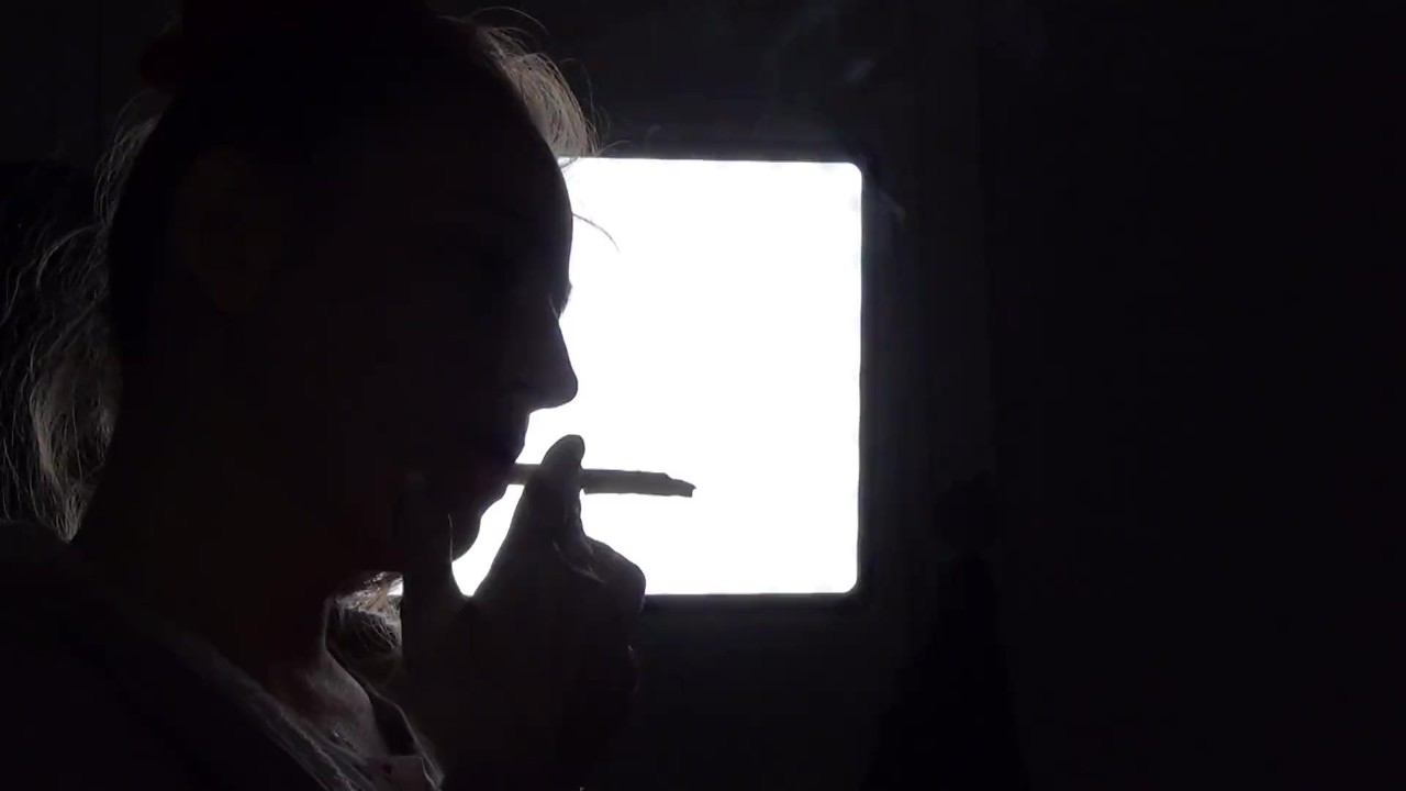 Shadow play while I light a cigarette. Alternative video, by long blonde hair girl