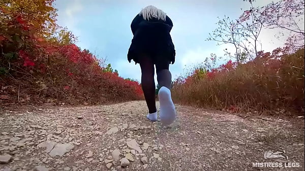 Follow my footsteps along the path in the evening lonely forest