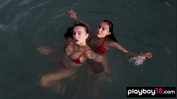 Ukrainian teen lesbians Gloria Sol and Sofi Ka posing naked by the pool