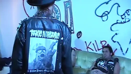 Rebellious young brunette in leather jacket sucks and takes two cocks
