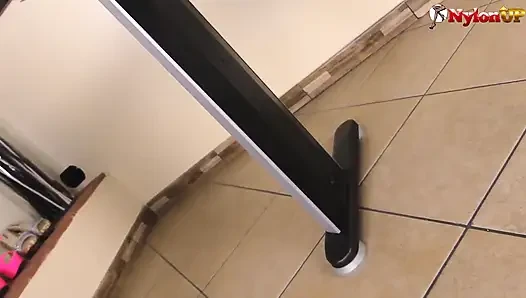 Jessica plays with her feet on the desk