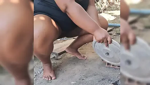 Hot neighbor prepares lunch in the backyard, and shows her pussy outdoors