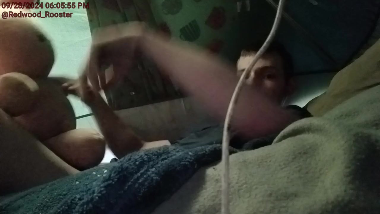 Young muscle man stretching balls while masturbation