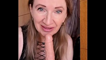 Busty GILF shows her secrets: a secret closet with a collection of dildos, sucks them and gives jerk instructions