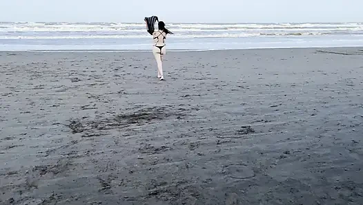 My neighbor loses her clothes at the beach.
