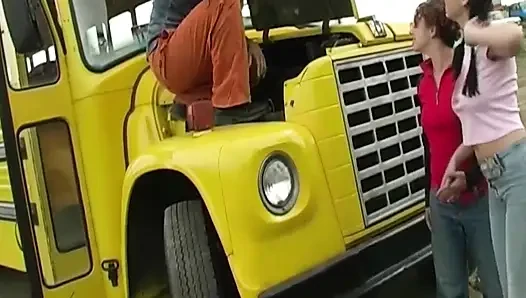 Brunette and Redhead Share Cock on Yellow Truck