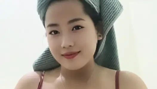 Young mommy looking beautiful after a shower, squeezing her big tits.