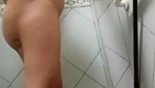 taking a bath and showing her beautiful face .