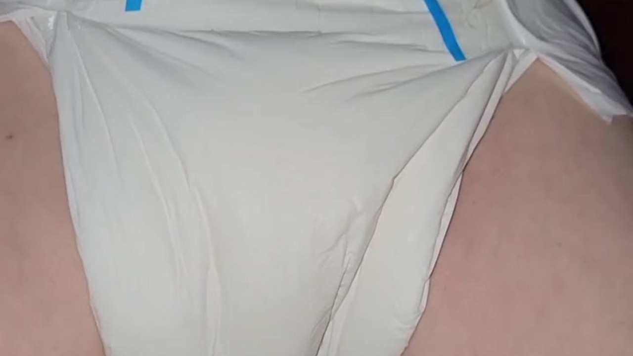 Diaper girl pees thick diaper