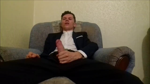 After working in the office, the guy jerks off his cock and ends up in an office suit