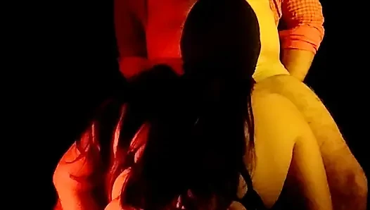 An Indian couple having intense sex in a dark room.