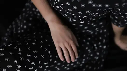 wearing a beautiful dress, masturbating while showing off her vagina
