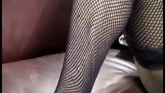 Horny black babe spreads her pussy and licks her tits on sofa