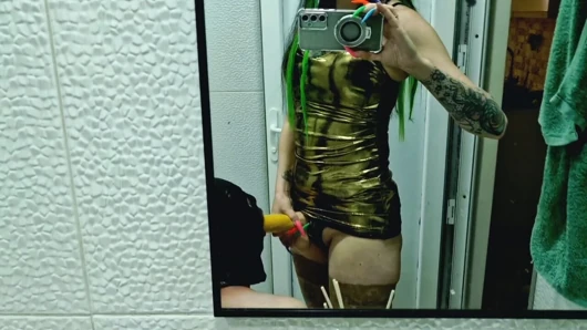 A slave is cleaning a dirty toilet when Dominatrix Nika comes to him with a strap-on and makes him take the strap-on in his mout