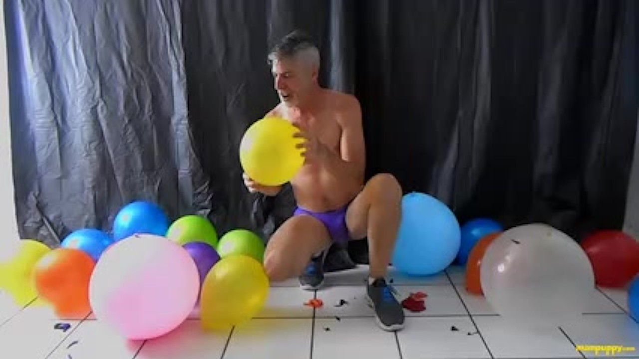 Gay daddy pops and rubs his big cock against balloons