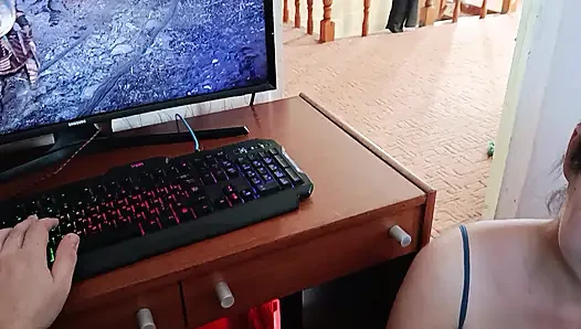 Korean woman sucks a nerd's cock while he's playing on the computer