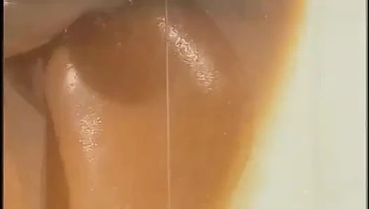 Two Exotic Beauties with Slender Tanned Bodies Caress Each Other's Wet Pussies
