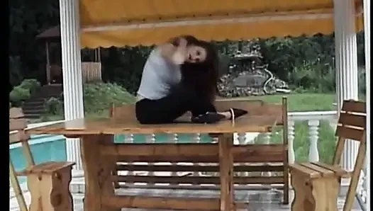 Beautiful brunette masturbates outdoors