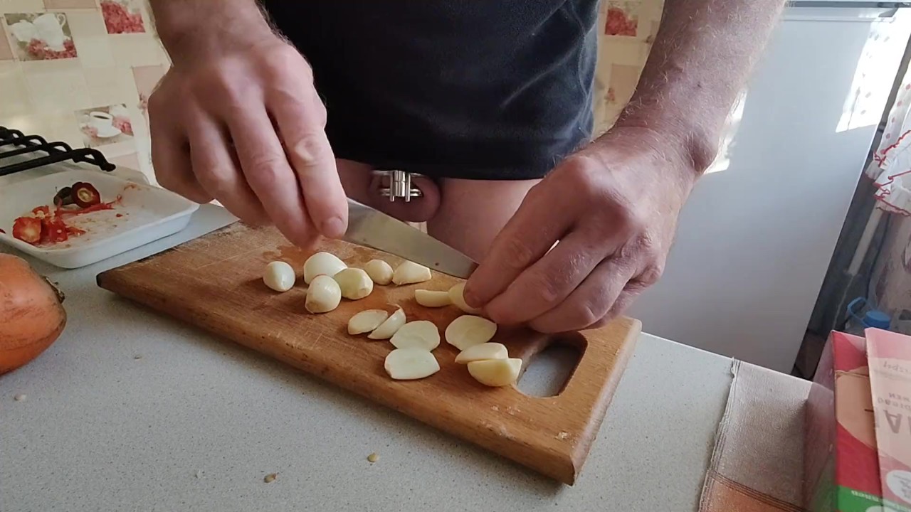 Guy with locked cock is in the kitchen