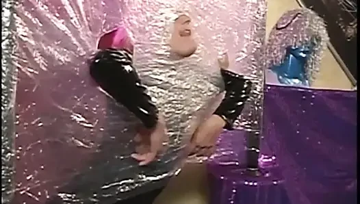 Dominated latex chick gets a hard bang from her dude