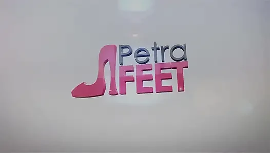 Leather Petra plays with her feet and smokes