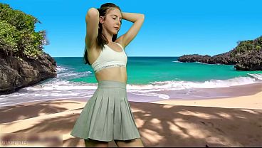 She's dancing on the beach without panties