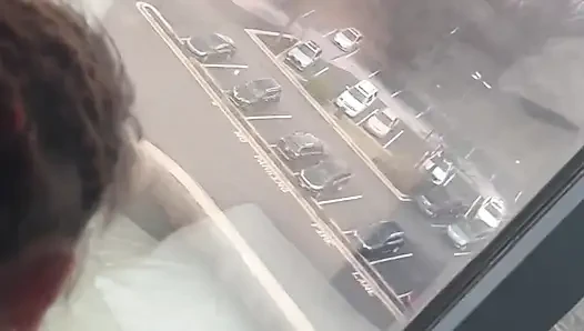 Giving Backshots While Looking Out of 12th Story Hotel