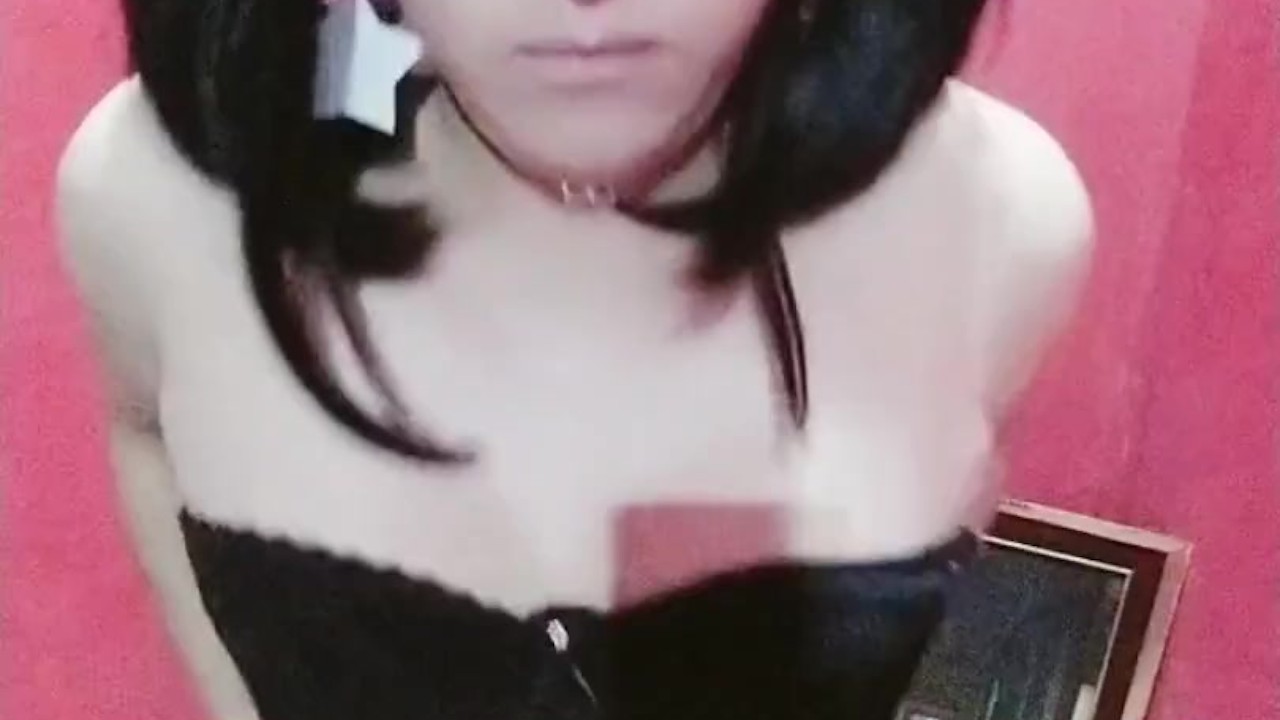 teen crossdresser in a tight black dress